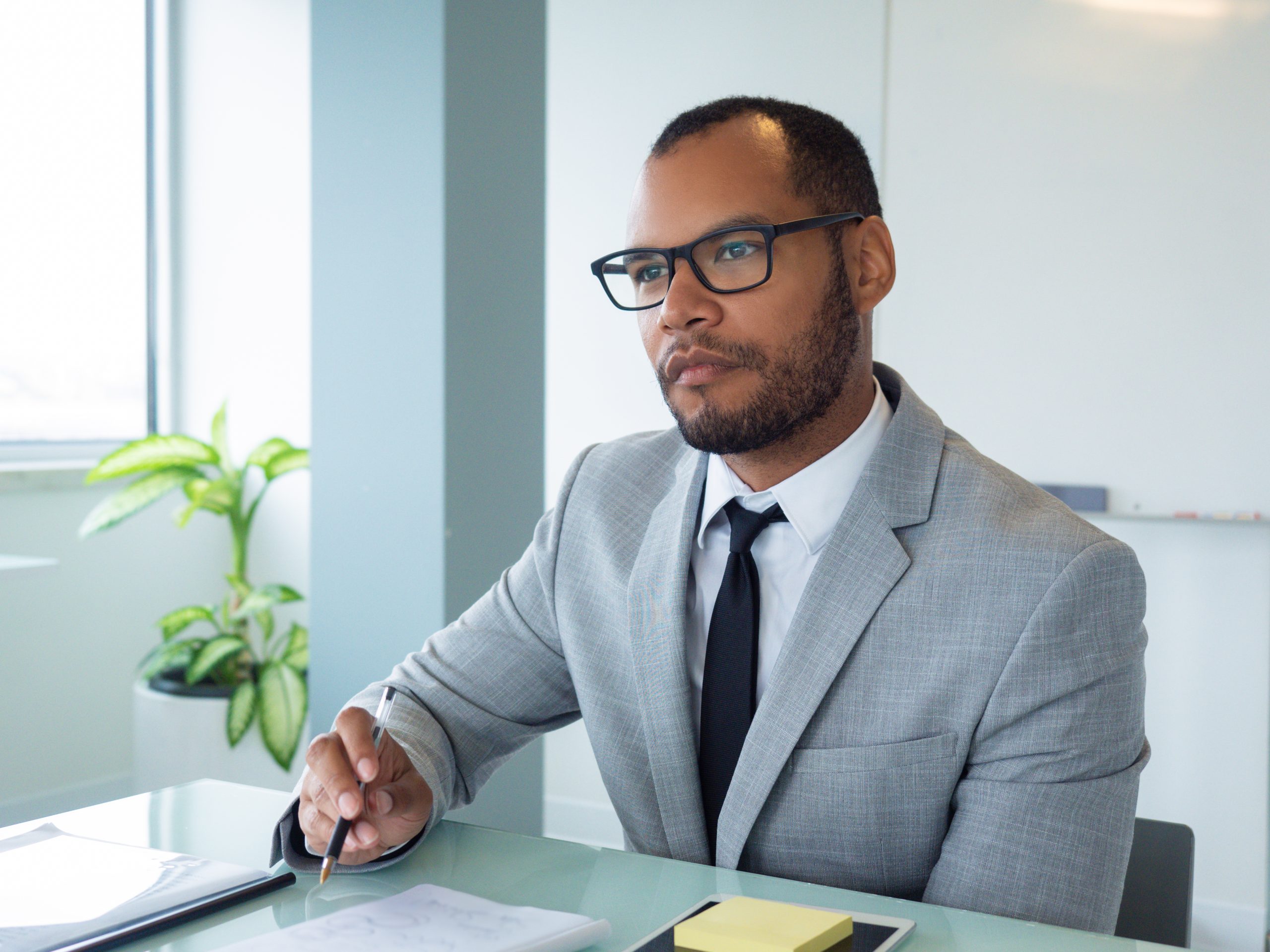 Focused business professional listening to speaker